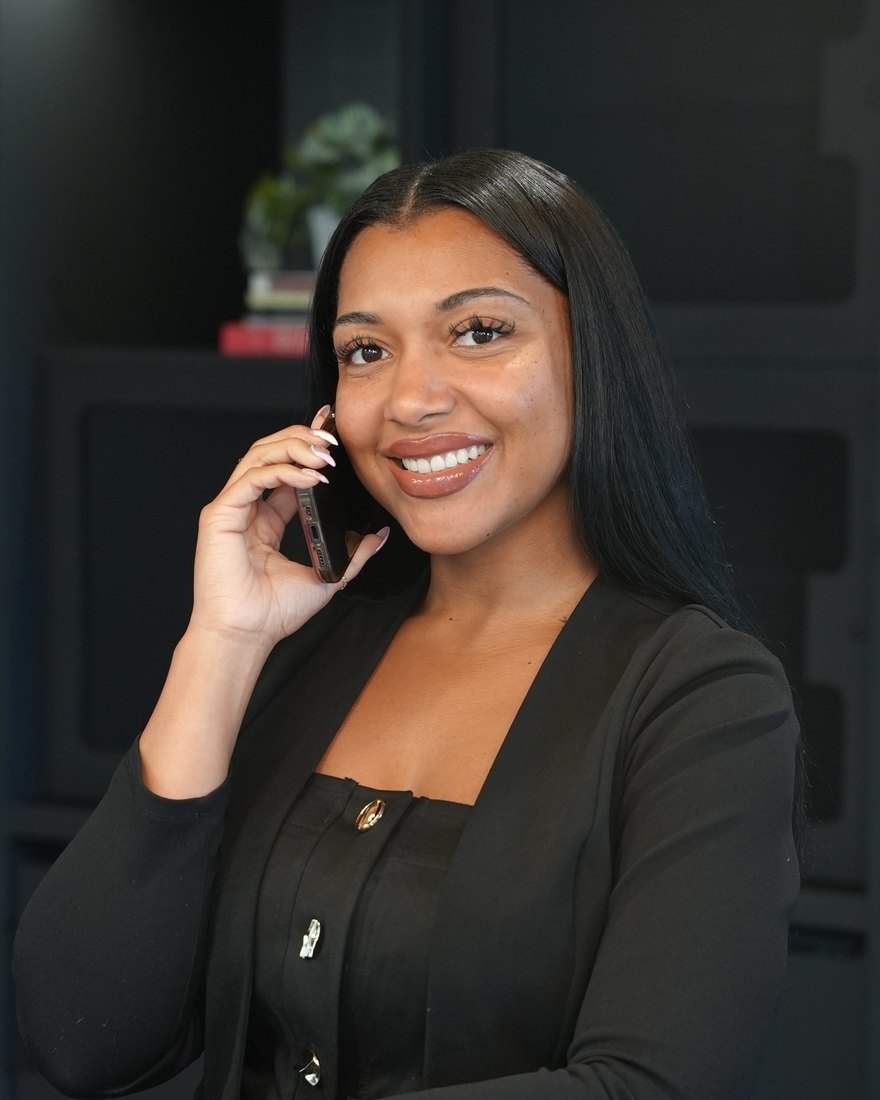 Tiaira Quinn on the phone with a client